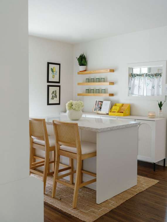 The Café: a marble island with cane barstools and floating shelves